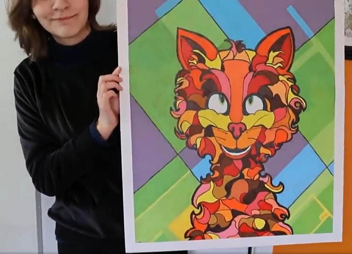 Nicole Prudchenko holding one oher paintings of a lion colored in orange, yellow, and red sitting in front of a background of green, blue, and yellow graphic squares and stripes.  She is wearing a black shirt. 